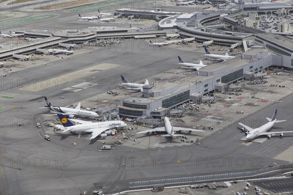 Aerial view of airplanes at airport terminal