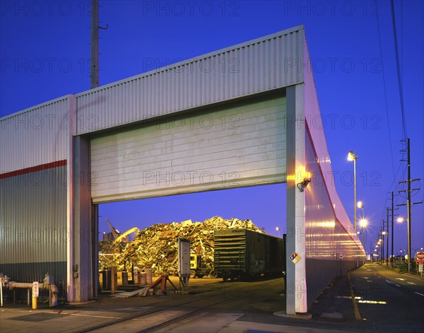 Open garage door at junkyard