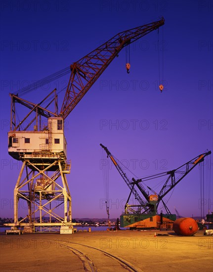 Cranes at harbor at night