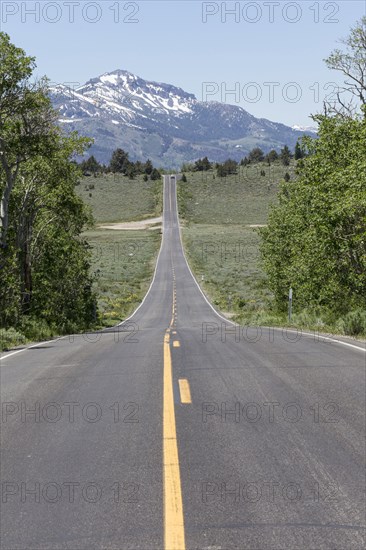 Distant car on freeway near mountain