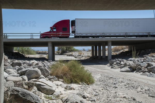 Semi-truck crossing bridge