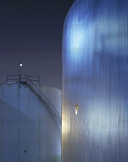 Staircase on storage tank at night