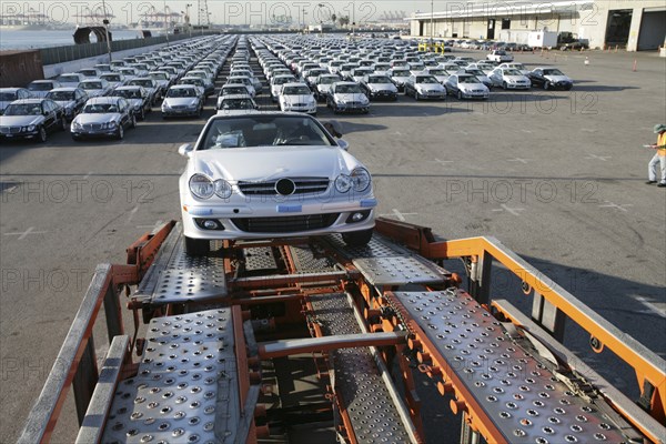 Car on trailer at car factory