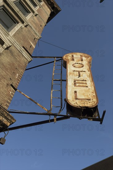 Decrepit hotel sign on building