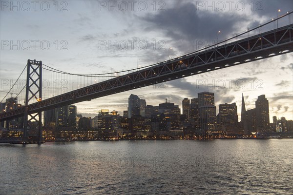 Clouds over urban bridge at waterfront