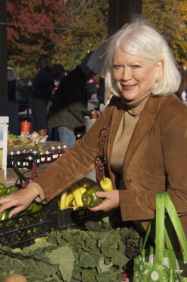 Older Caucasian woman shopping at farmer's market