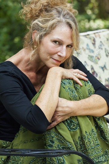 Caucasian woman sitting outdoors