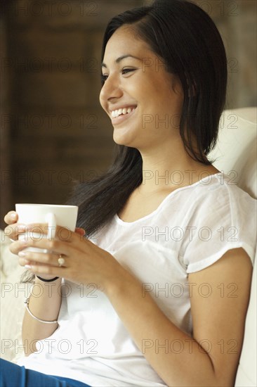 Woman having cup of coffee