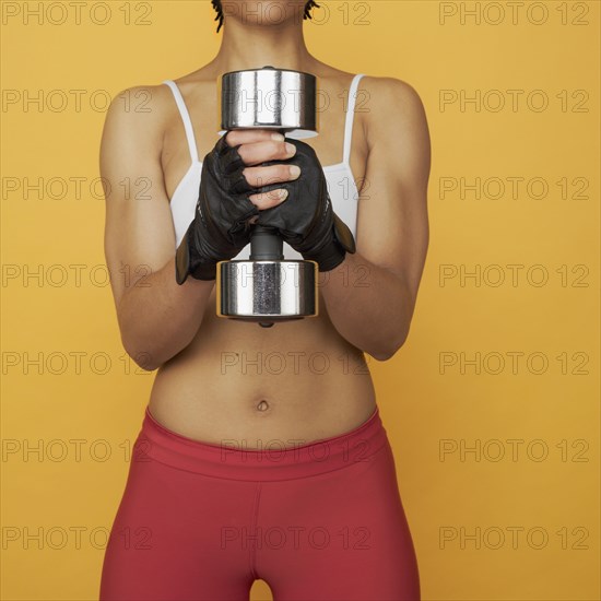 African woman lifting weights