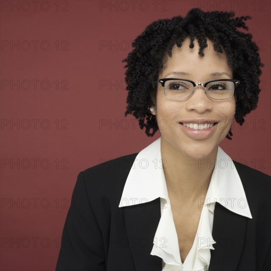 Studio shot of African businesswoman smiling