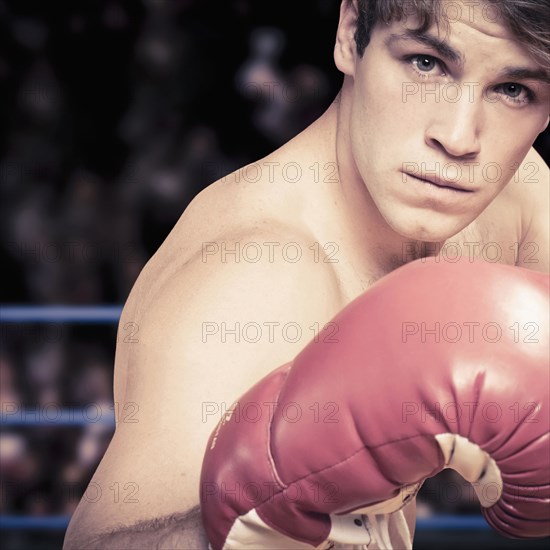 Caucasian boxer with fists raised