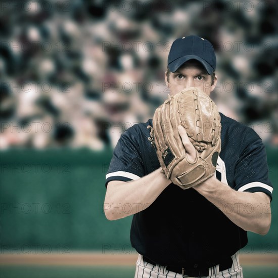 Caucasian baseball player holding glove