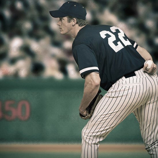 Caucasian baseball player ready to throw ball