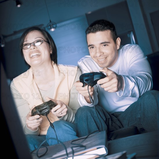 Couple playing video games together