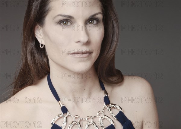 Close up of mixed race woman wearing evening gown