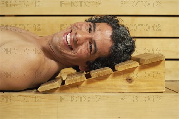 Man relaxing in sauna