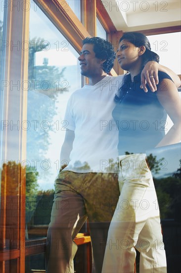 Couple looking through window