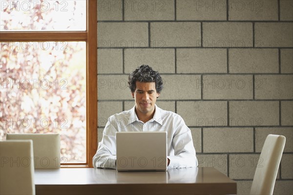 Man typing on laptop