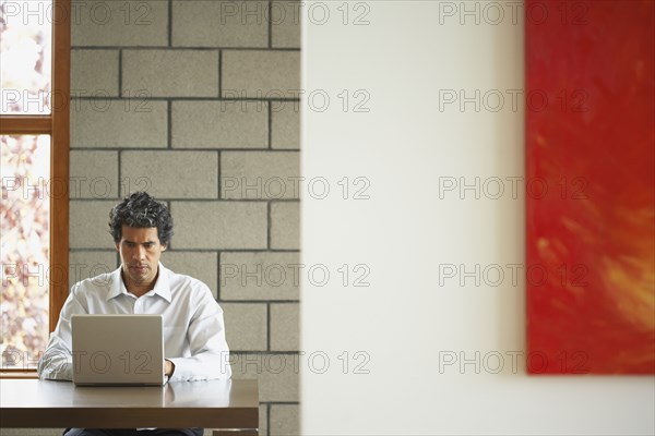 Man typing on laptop