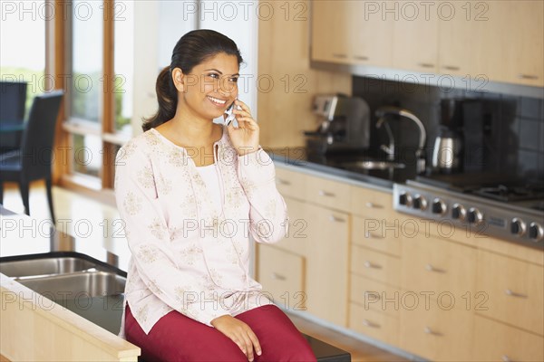 Indian woman talking on cell phone