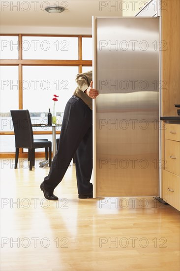 Man looking in refrigerator