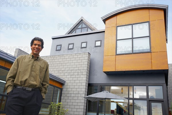 Man standing in front of house