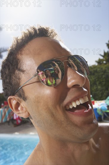 Multi-ethnic group of friends enjoying pool party