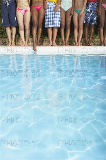 Multi-ethnic group of friends enjoying pool party