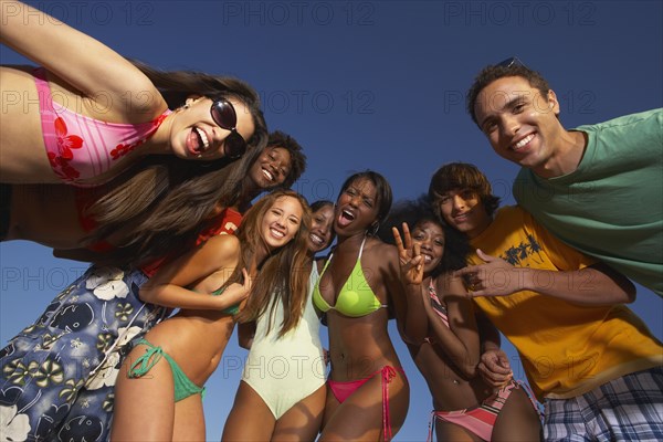 Multi-ethnic group of friends hugging