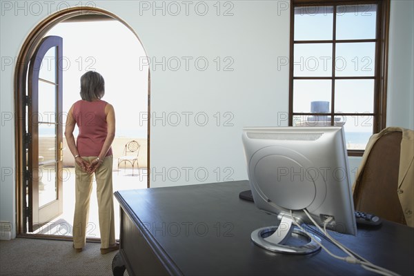 Businesswoman standing in doorway of office