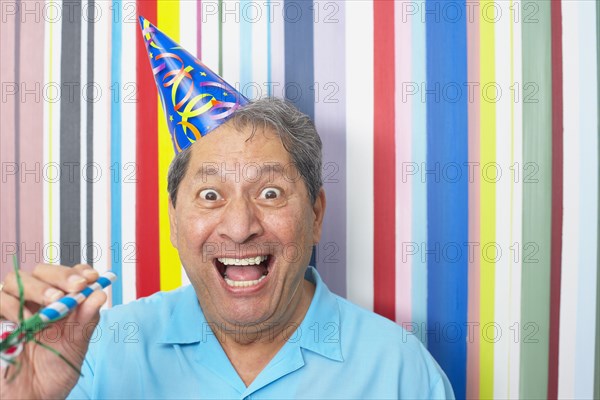 Hispanic man in party hat