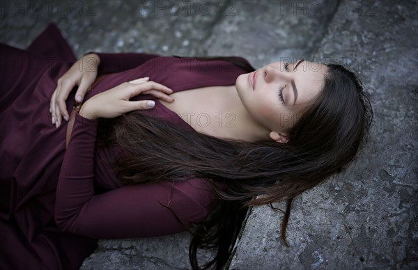 Caucasian woman laying on staircase