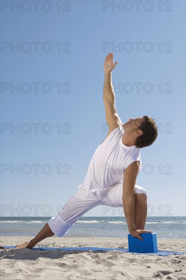 Hispanic man practicing yoga