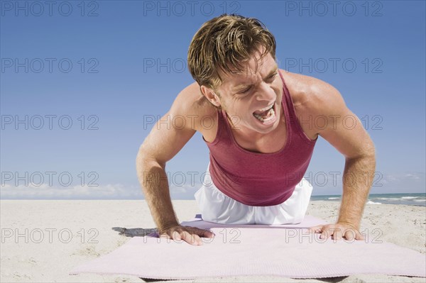 Hispanic man doing push-up