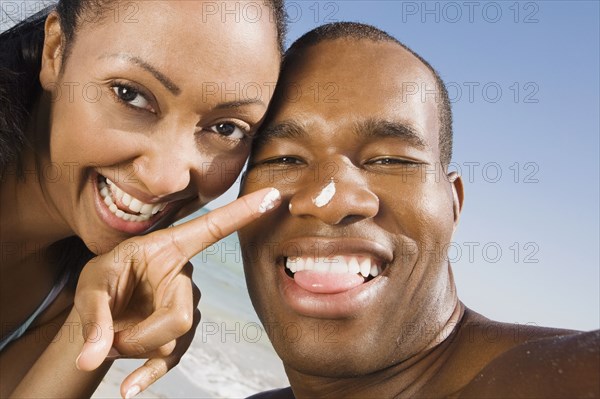 Multi-ethnic couple laughing