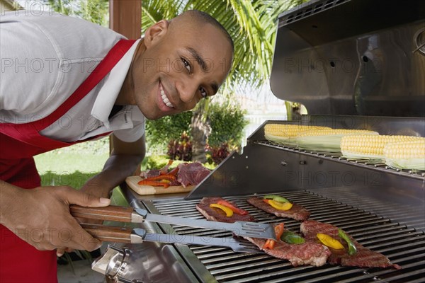 African man barbecuing