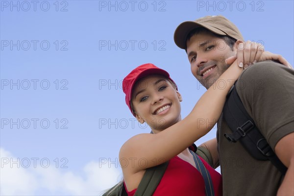 Hispanic couple hugging