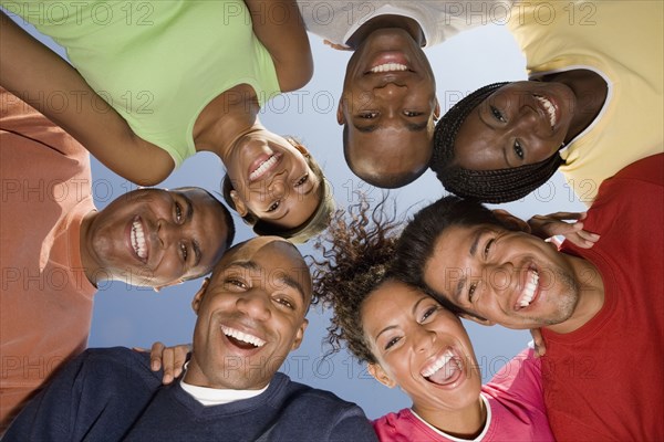 Multi-ethnic friends in huddle