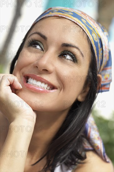 Hispanic woman looking up