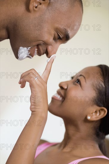 African couple smiling at each other