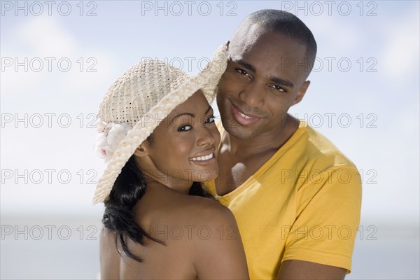 Multi-ethnic couple hugging