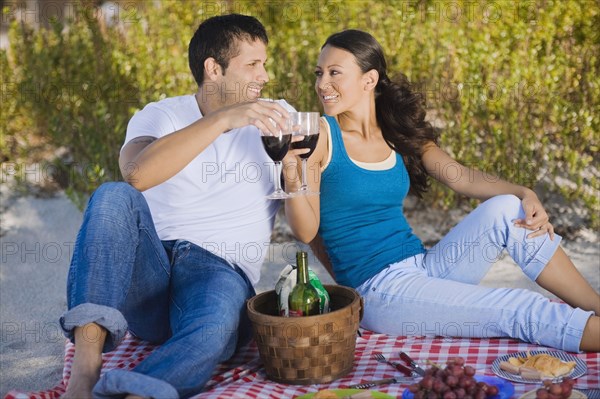 Hispanic couple having picnic