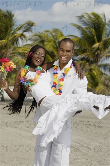 African man carrying wife