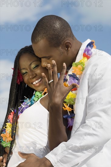 African couple hugging