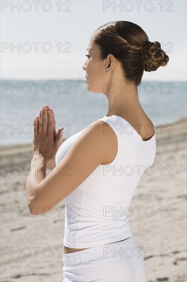 Hispanic woman practicing yoga