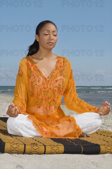 Hispanic woman meditating