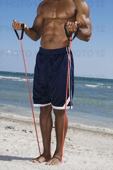 African man stretching with exercise band