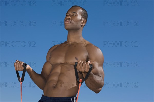 African man stretching with exercise band