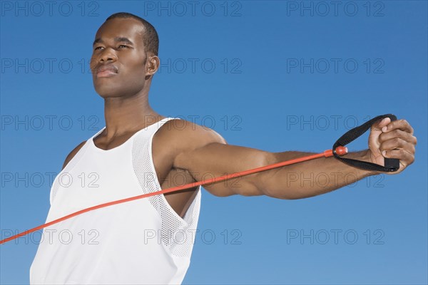 African man stretching with exercise band