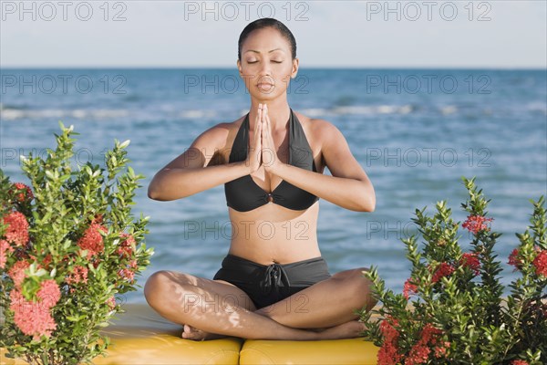 Hispanic woman meditating